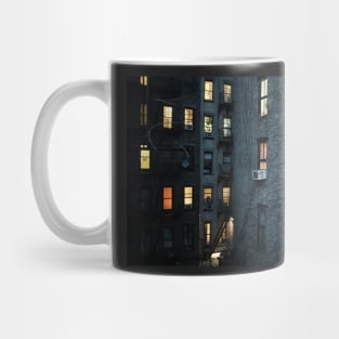 A New York City courtyard with lit windows at dusk Mug